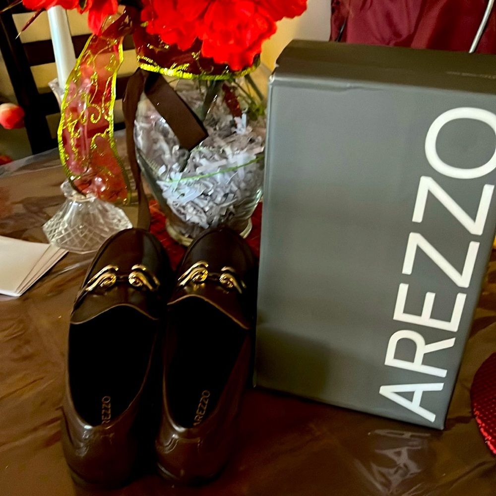 Arezzo Brown leather loafer. This style a flat heels makes walking look good.